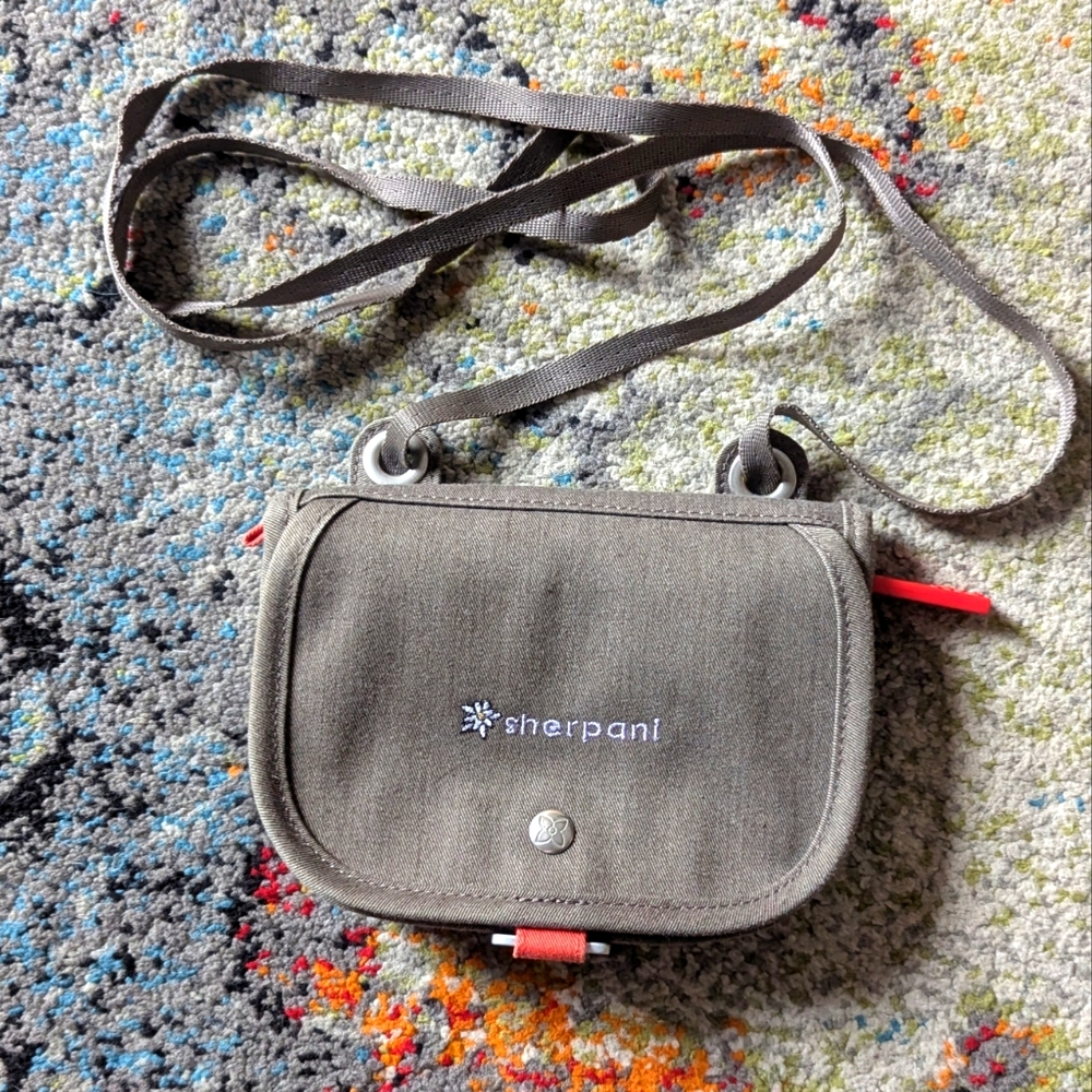 Mini Sherpani purse with magnetic and zipper closure.